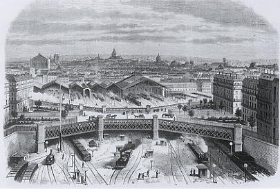 1868 : La gare Saint-Lazare nouvellement reconstruite. Au premier plan, le pont de l'Europe devenu la place de l'Europe